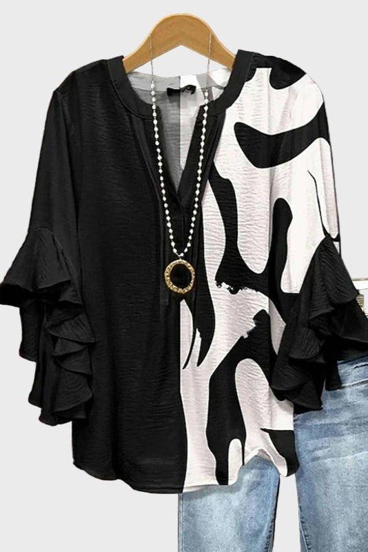 Elegant blus med unikt mönster och volangärmar