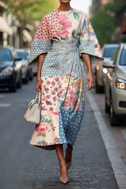 Konstfullt Midi-Klänning med Blommig Design och Elegant Silhuett