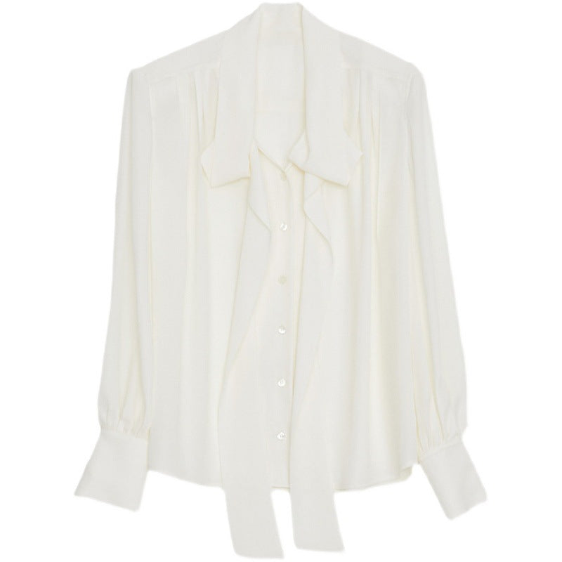 Feminine Bluse med Sløjfe og Trendy Detaljer