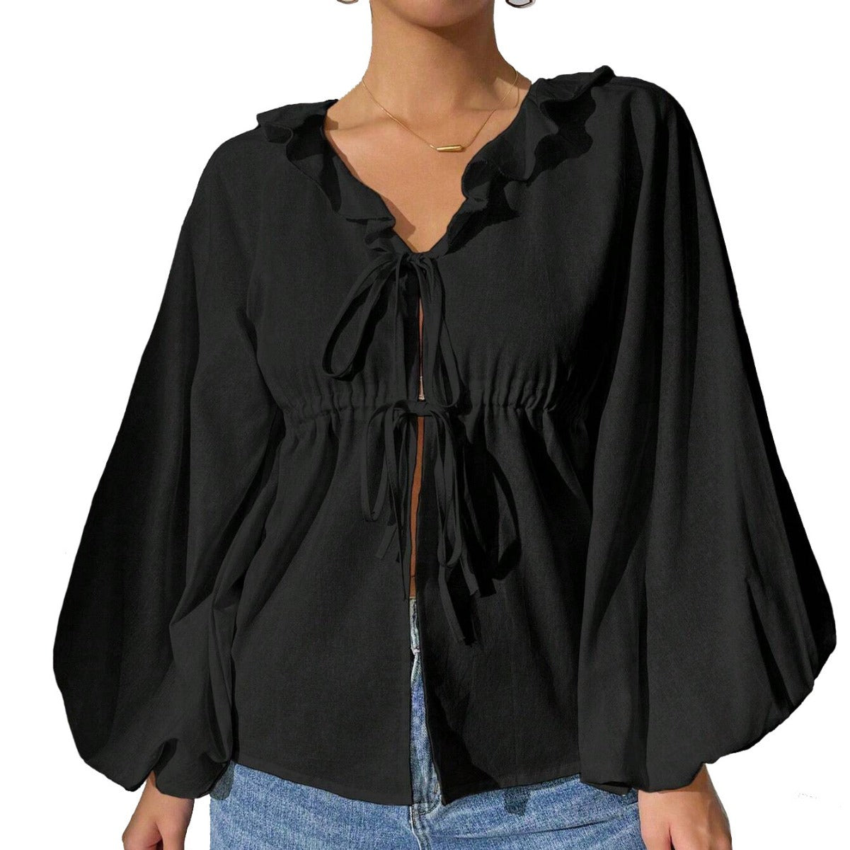 Elegant skjortjacka med voluminösa ärmar och feminina detaljer
