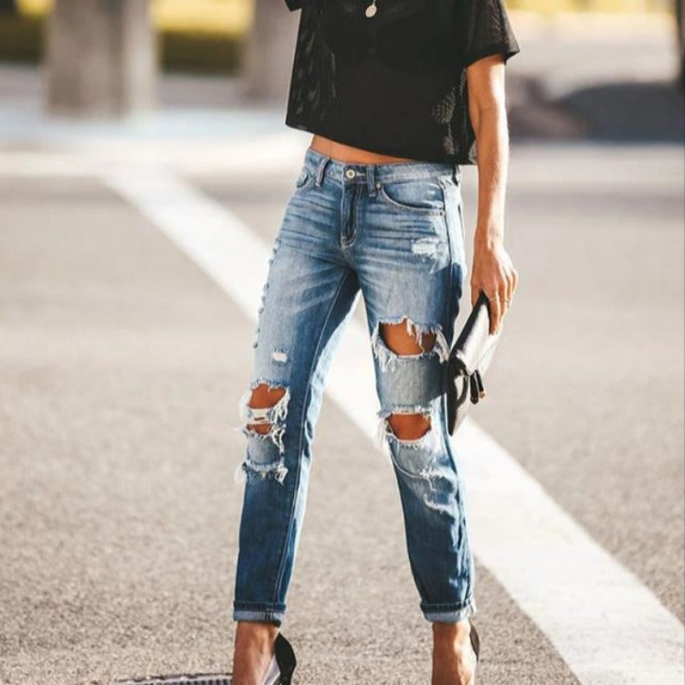 Moderne Slim-Fit Jeans med Trendy Slid og Frayed Detaljer
