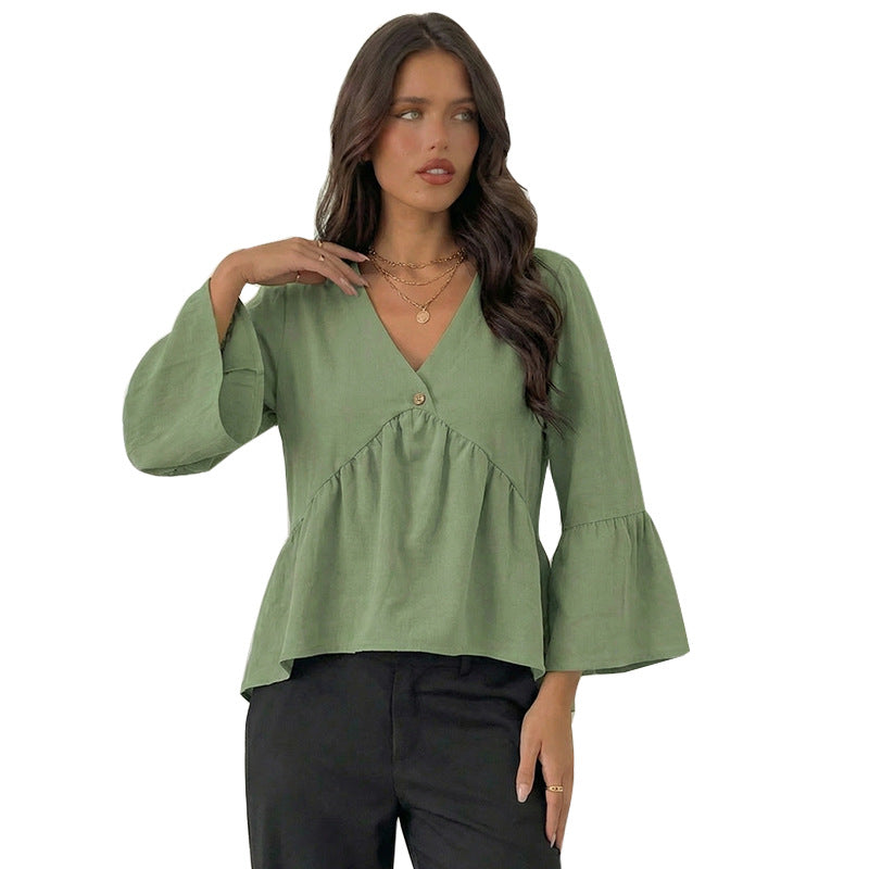 Elegant blus med vida ärmar och knappdetaljer