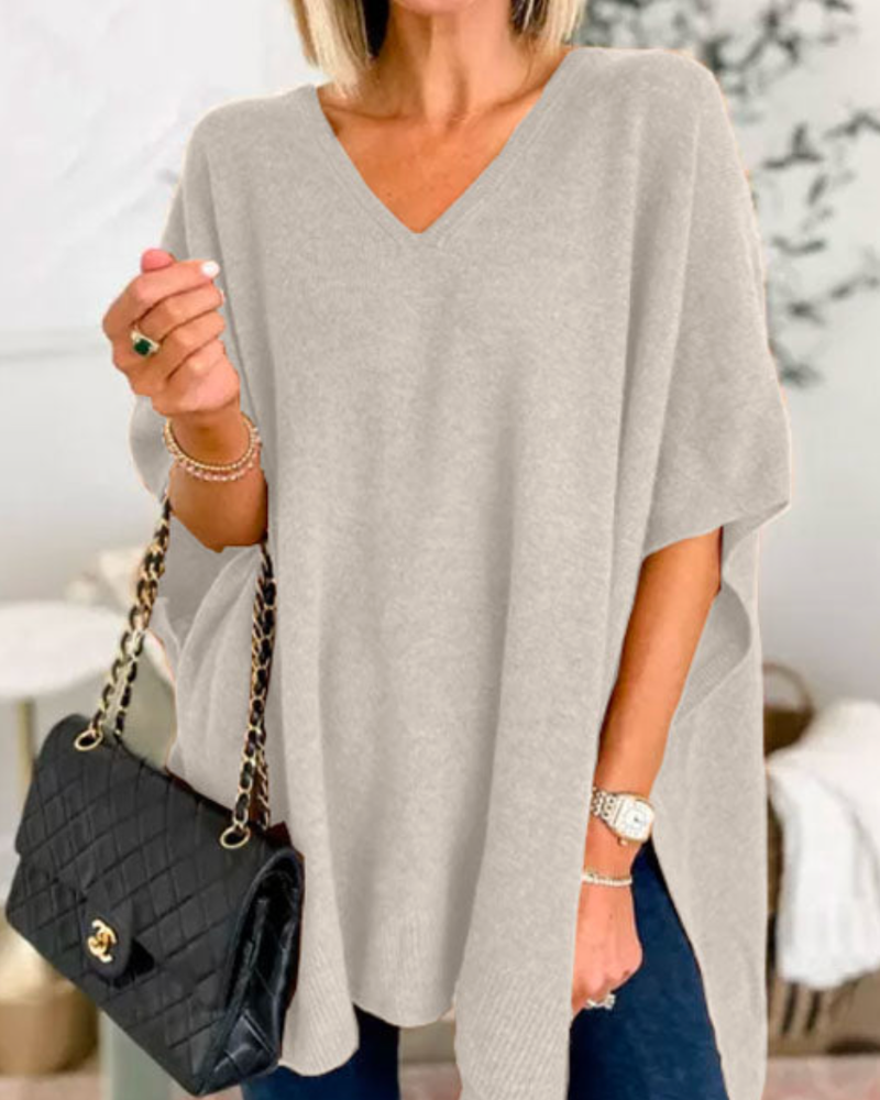 Loose Fit stickad poncho med V-ringning