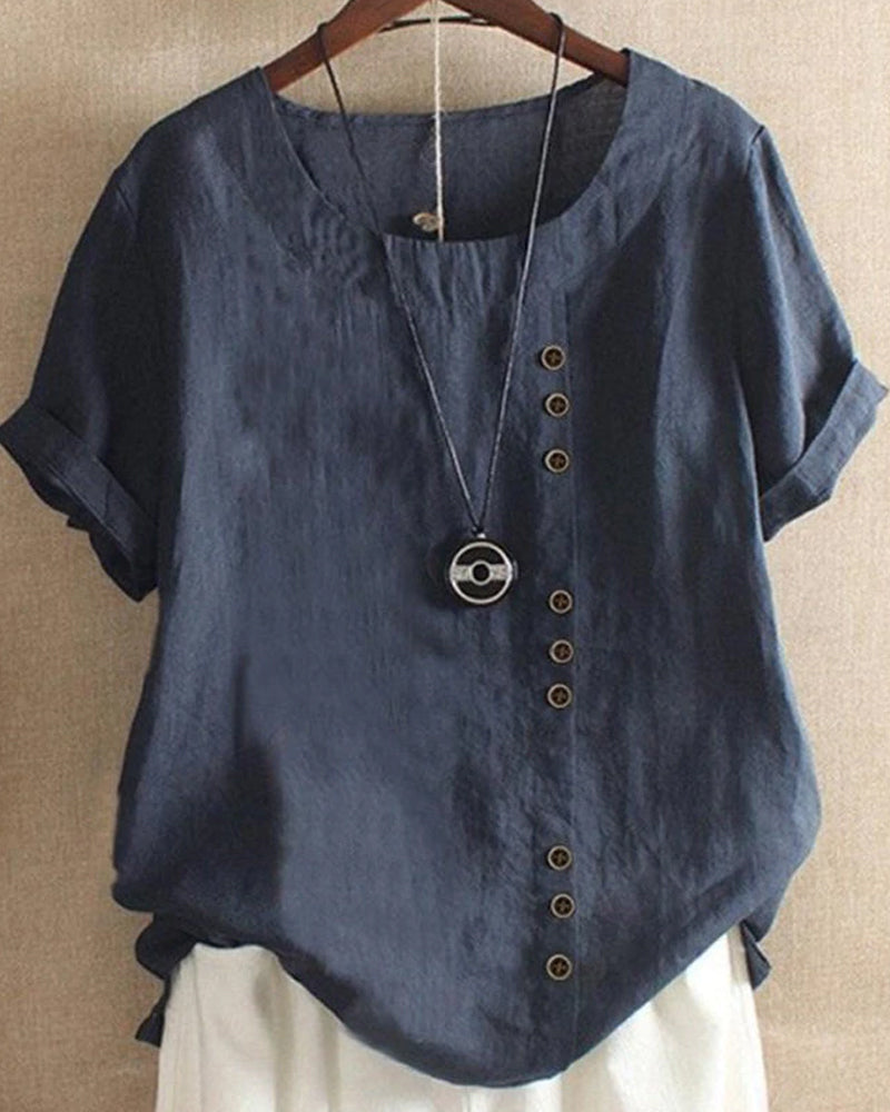 Sofia | Elegant blus med knappdetaljer och korta ärmar