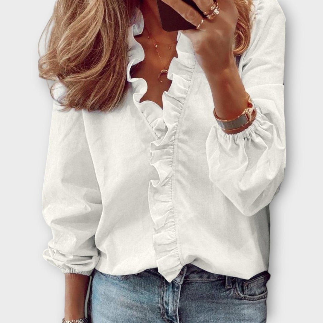 Femininitet och Elegans: V-ringad Blus med Volanger