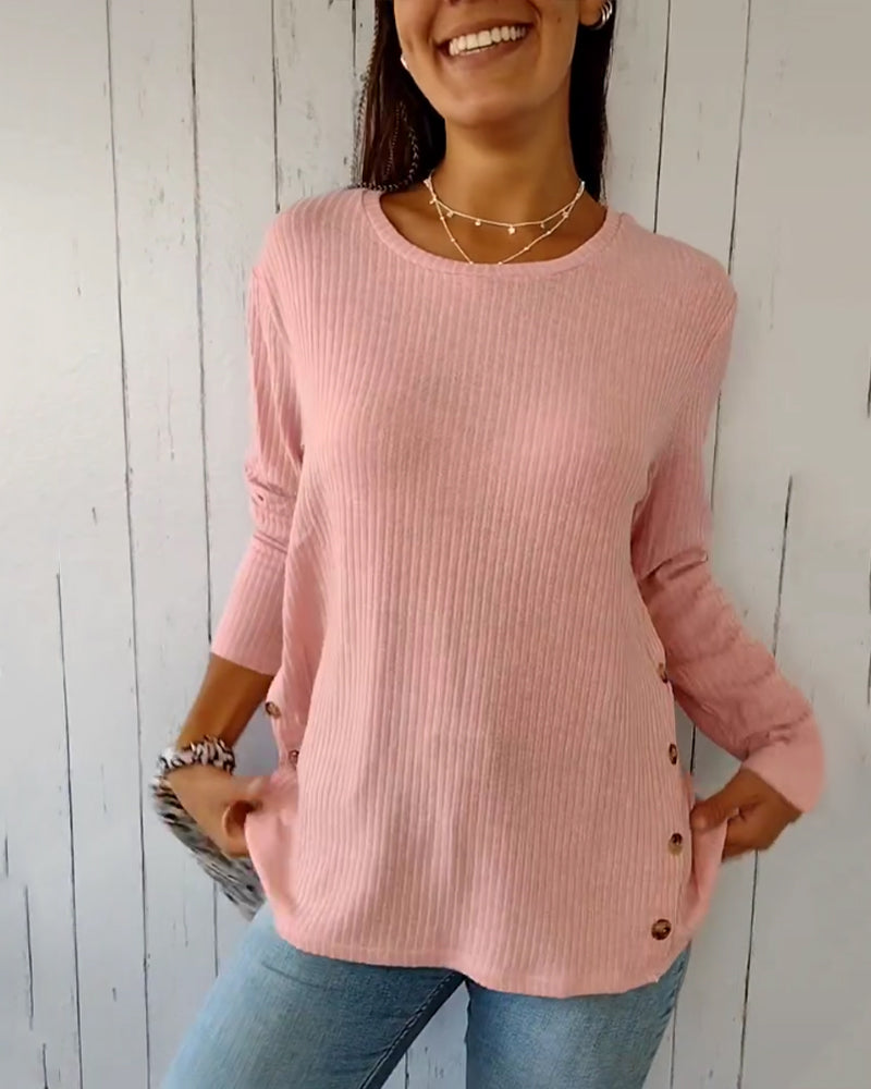 Elegant, strikket top med lange ærmer og rund hals