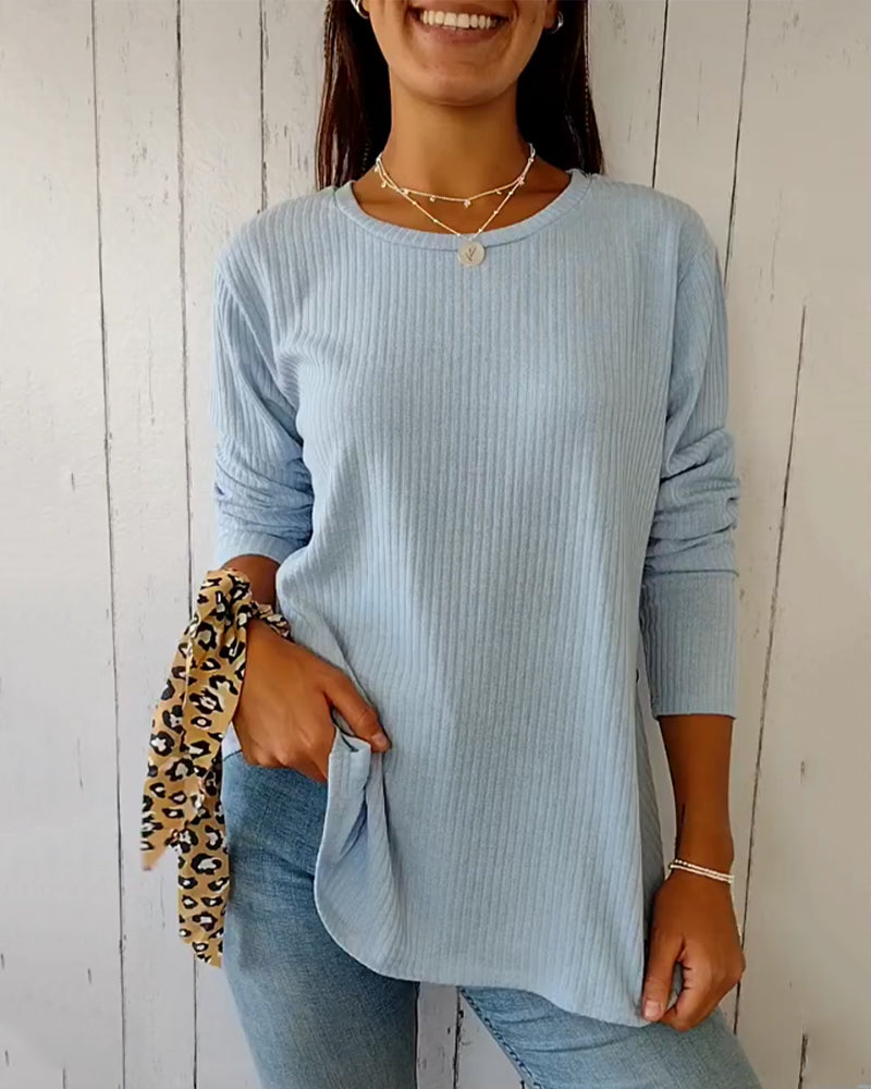 Elegant, strikket top med lange ærmer og rund hals