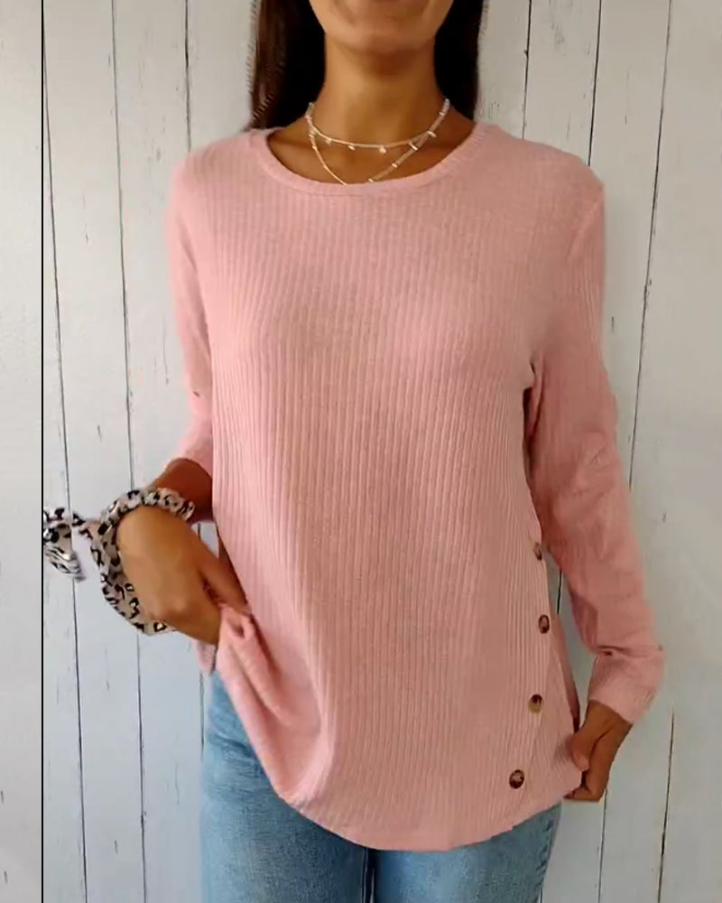 Elegant, strikket top med lange ærmer og rund hals