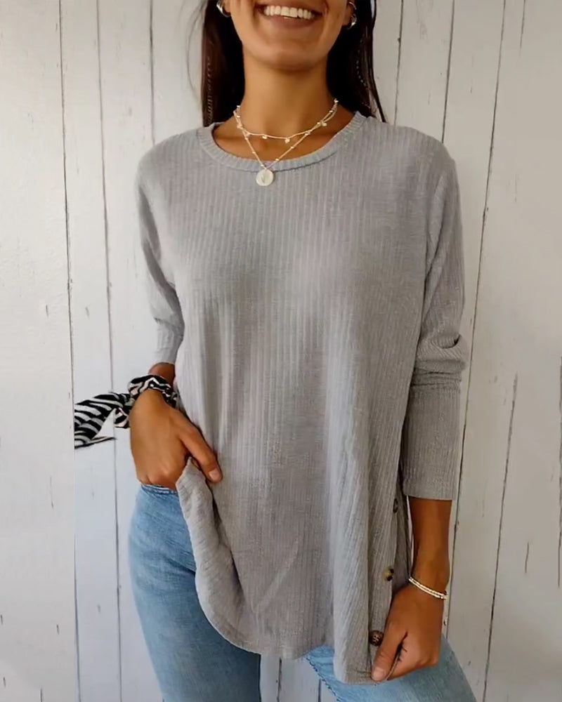 Elegant, strikket top med lange ærmer og rund hals