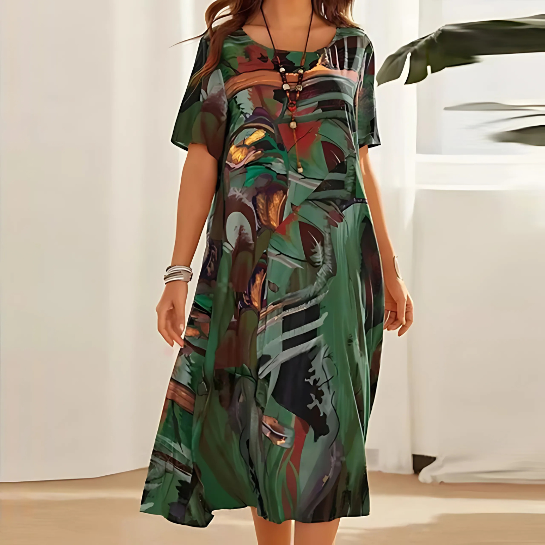 Konstfullt Klänning med Abstrakt Mönster och Elegant Silhuett