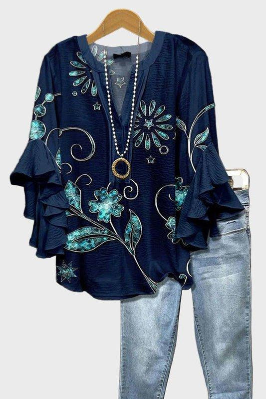 Feminin blus med blommönster och lätt volangärm
