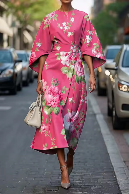 Konstfullt Midi-Klänning med Blommig Design och Elegant Silhuett