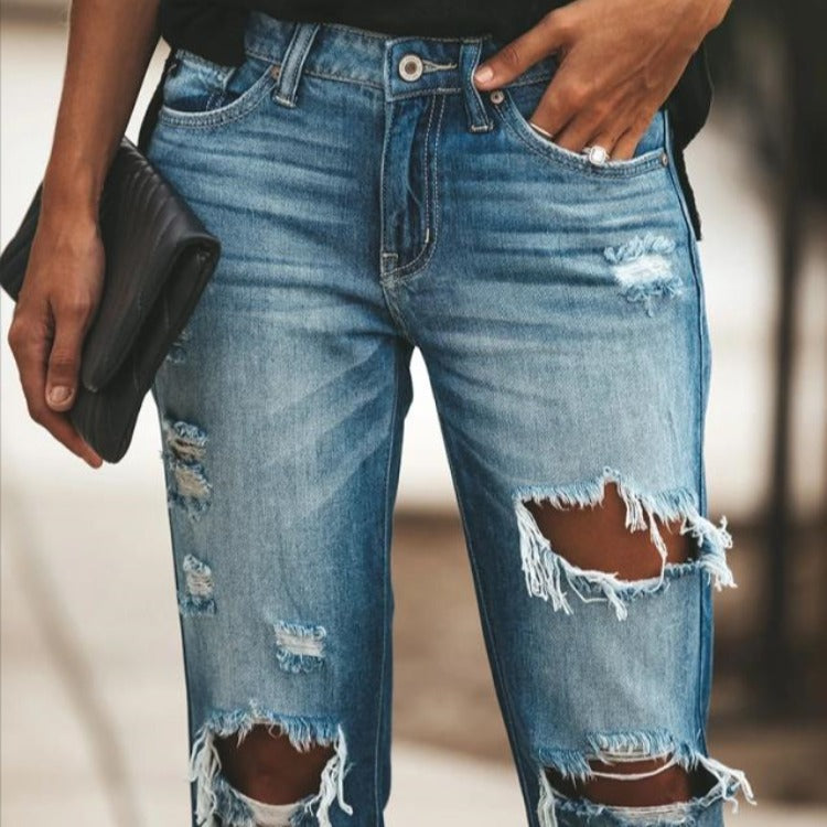 Moderne Slim-Fit Jeans med Trendy Slid og Frayed Detaljer