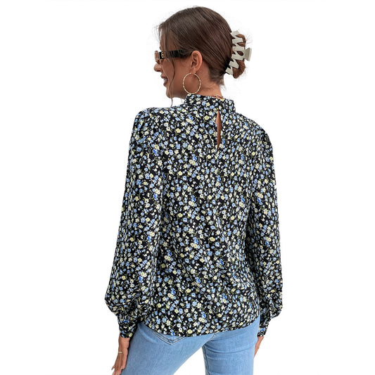 Elegant blus med hög krage och voluminösa ärmar
