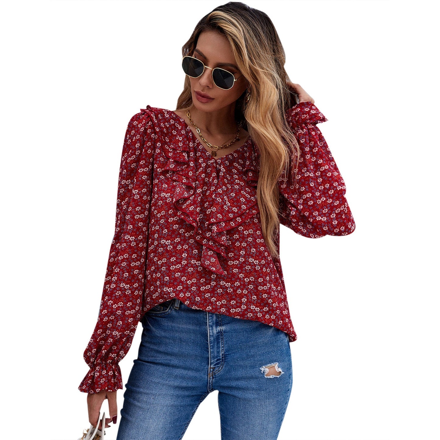 Elegant blus med smickrande detaljer och blomstertryck