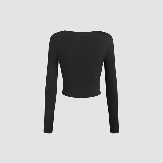 Stilfuld cropped langærmet bluse med elegant drapering