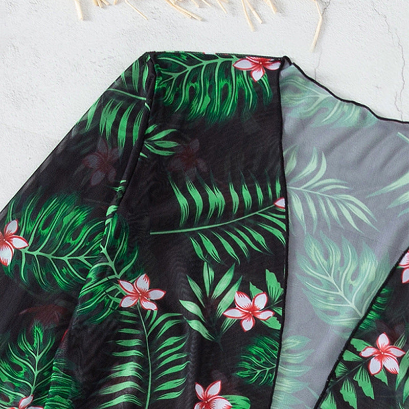 Elegant Baddräkt med Blommig Kaftan och Högskuren Trosa