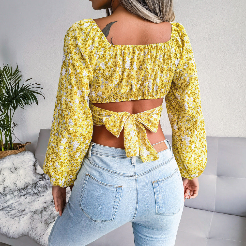 Feminine Bluse med Blomsterprint og Pufærmer