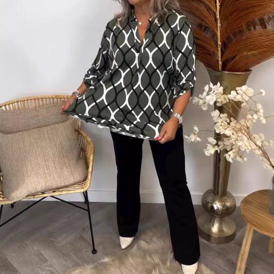 Elegant blus med grafisk design och praktiska fickor