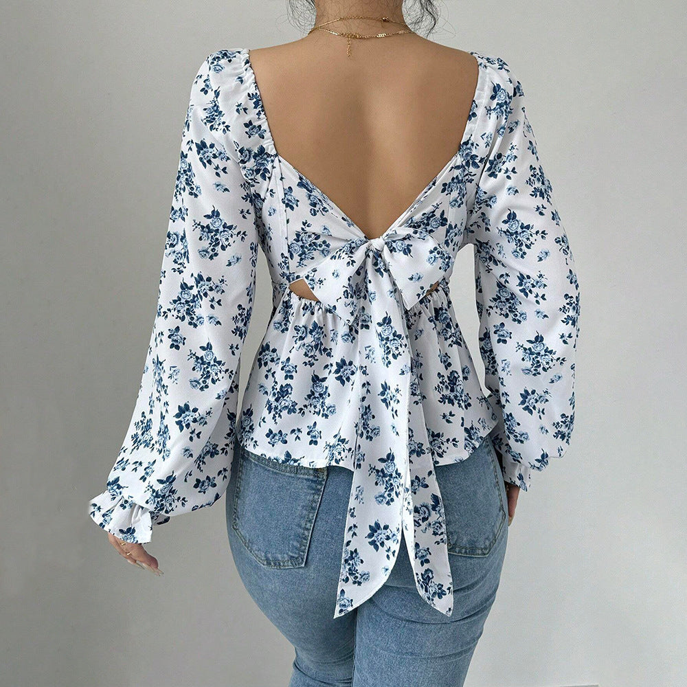 Stilfull blus med blomstertryck och puffärm