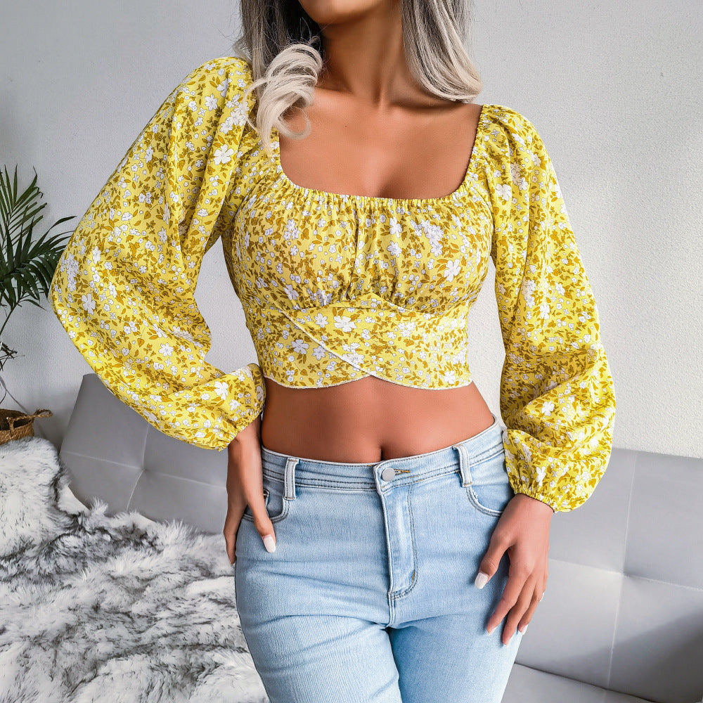 Feminine Bluse med Blomsterprint og Pufærmer
