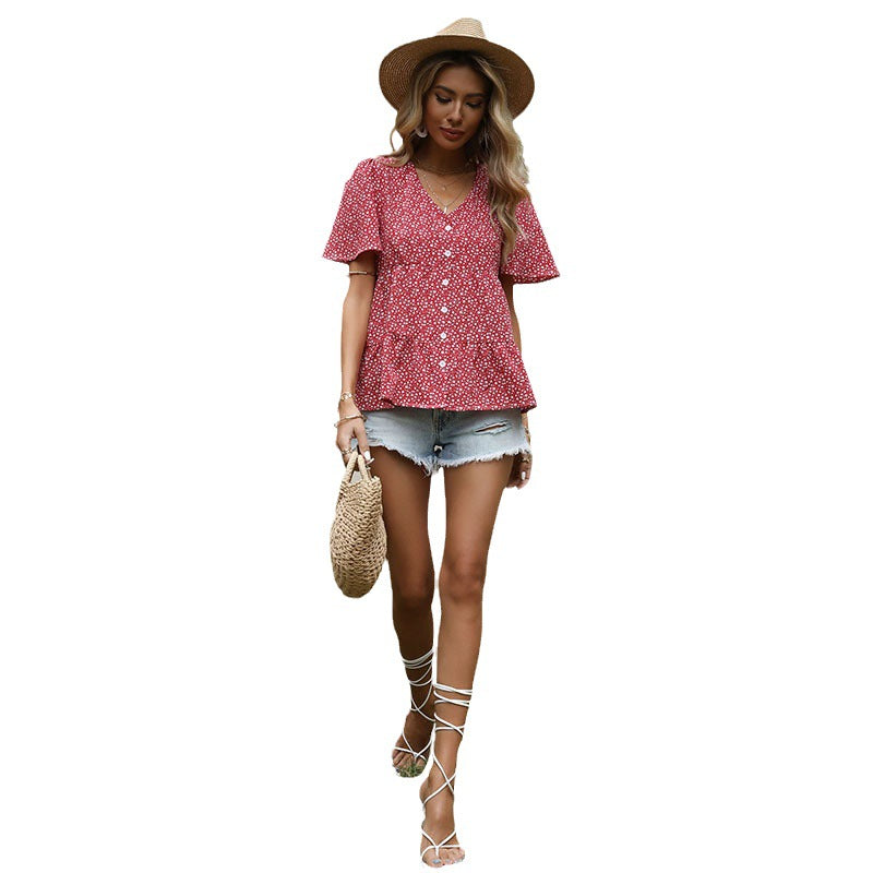 Elegant blus med smickrande detaljer och blomstertryck