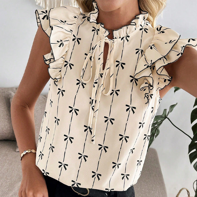 Elegant blus med smickrande detaljer och blomstertryck