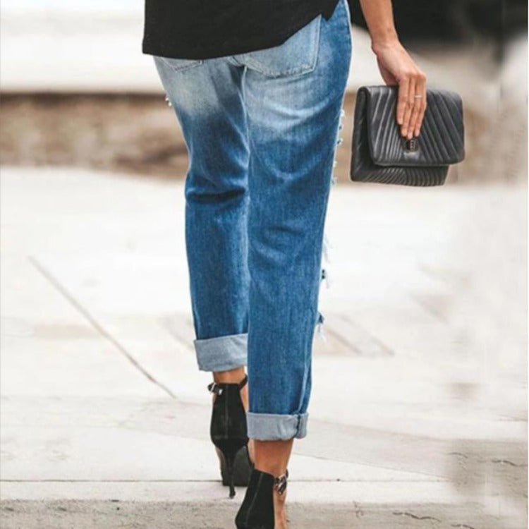 Moderne Slim-Fit Jeans med Trendy Slid og Frayed Detaljer