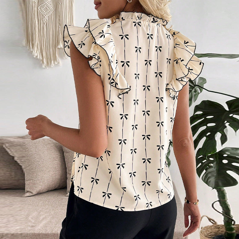 Elegant blus med smickrande detaljer och blomstertryck