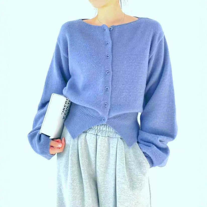 Kraftfuld Crop-Pullover med Knapdetaljer og Oversize Ærmer