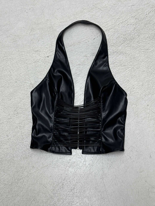 Snygg ärmlös topp med djup V-ringning och trendiga snörningar