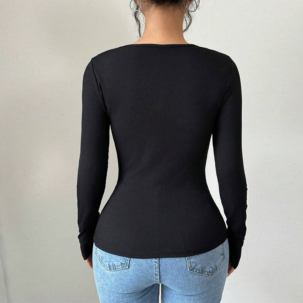 Elegant body med slående rosetter och långa ärmar