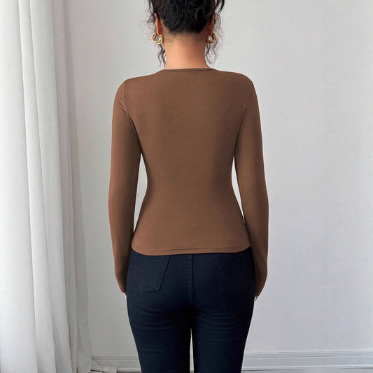 Stilfull Bodysuit med Unik Bindningsdesign och Rund Urringning