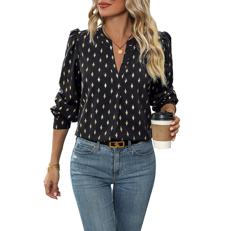 Feminine Bluse med Rynkedetaljer og Glitrende Print