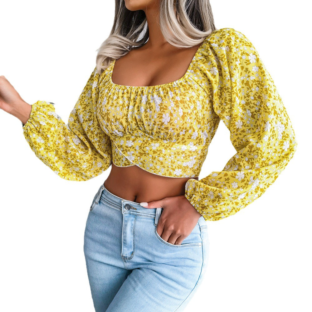 Feminine Bluse med Blomsterprint og Pufærmer