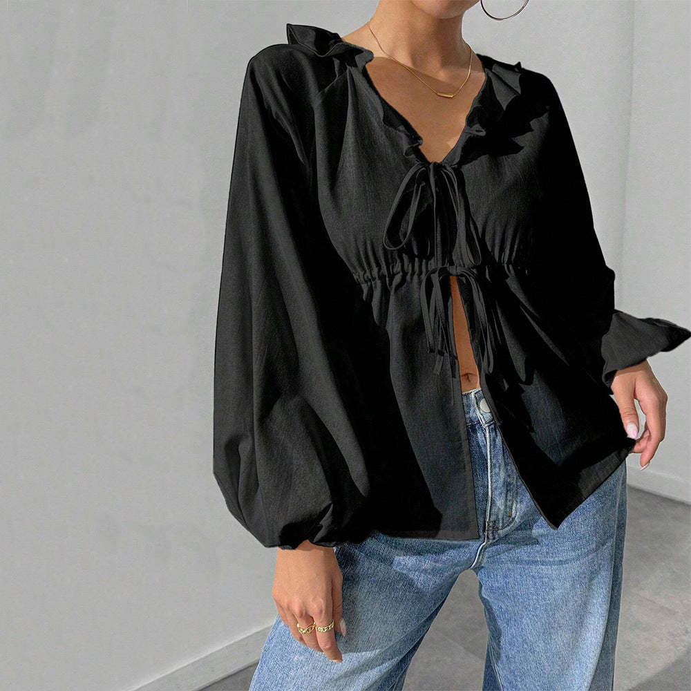 Elegant skjortjacka med voluminösa ärmar och feminina detaljer
