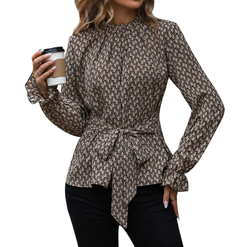 Chic blus med knytning och voluminösa ärmar
