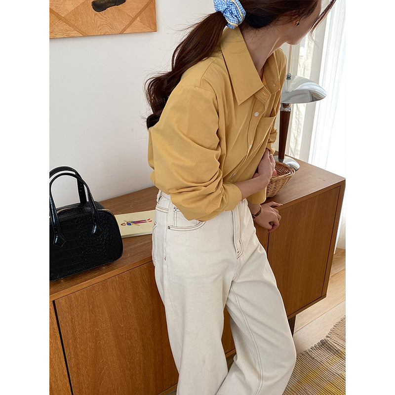 Chic Bluse med skarpt snit og subtile detaljer