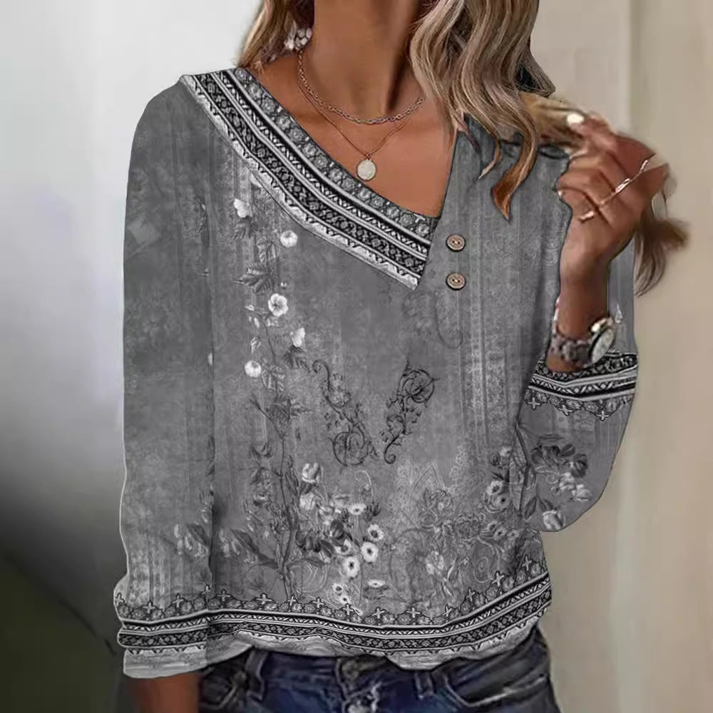 Blommig blus med V-ringning och eleganta detaljer