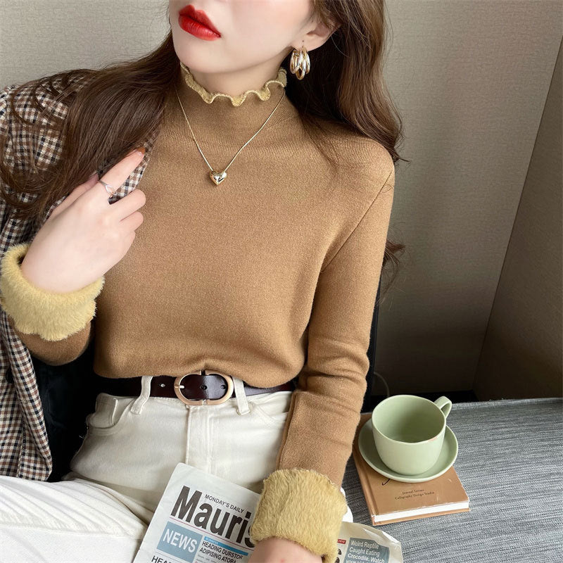 Chic cropped trøje med høj krave og feminine detaljer