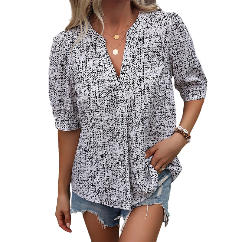Elegant Bluse med unik grafisk udsmykning og løs pasform