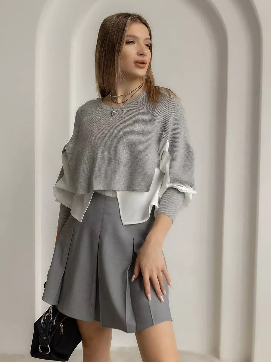 Stilfuld cropped pullover med unik lag-på-lag effekt