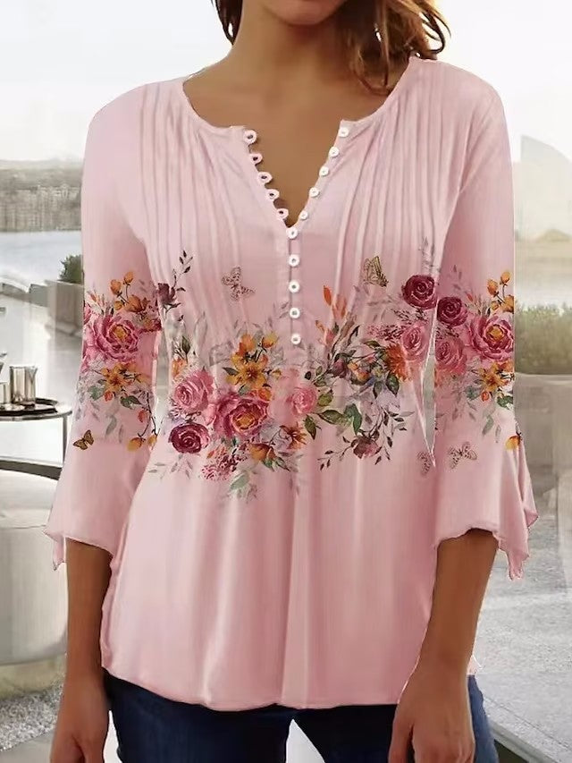 Elegant Blus med Blommigt Tryck och Knappsymfoni