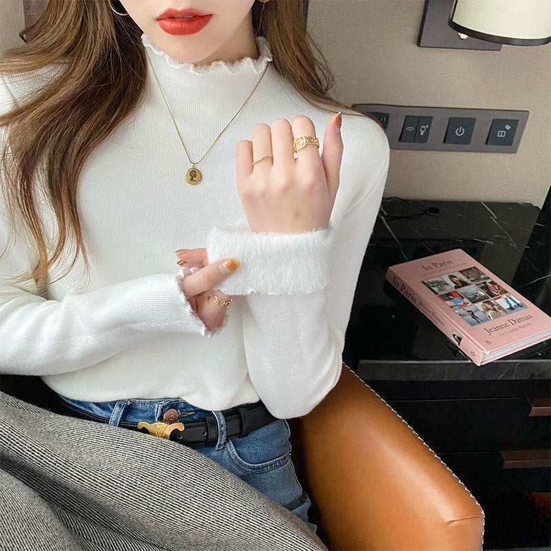 Chic cropped trøje med høj krave og feminine detaljer