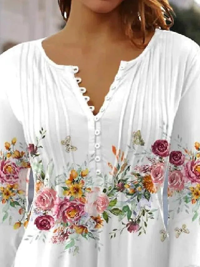 Elegant Blus med Blommigt Tryck och Knappsymfoni