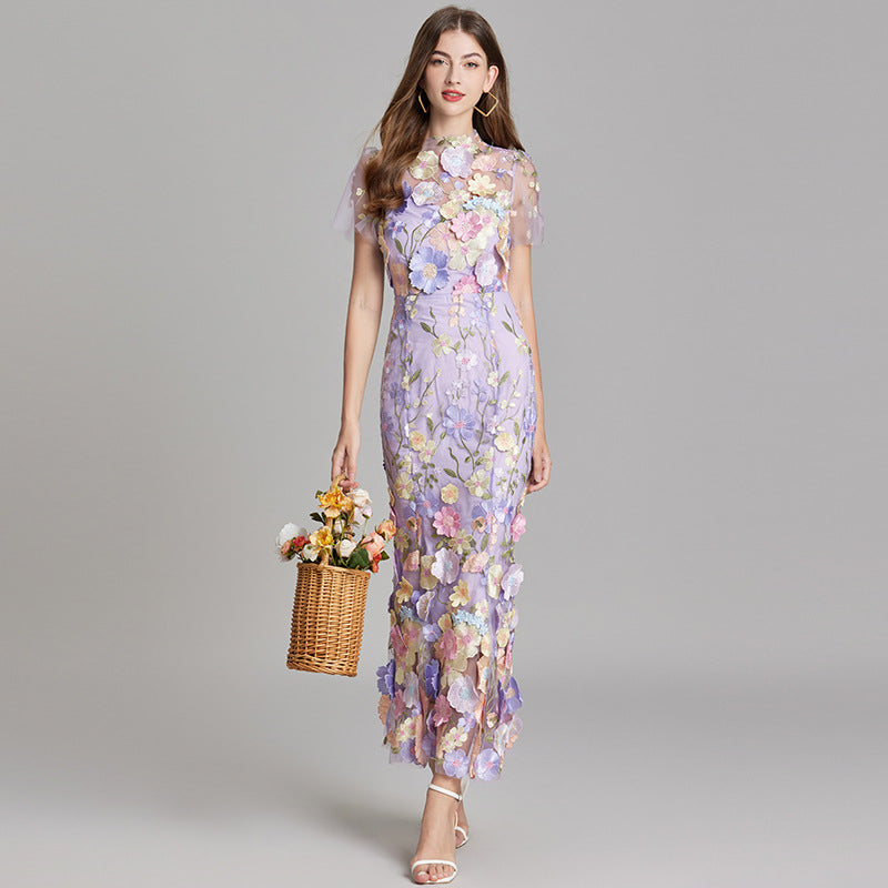 Livia | Elegant maxiklänning med blommigt mönster och transparens