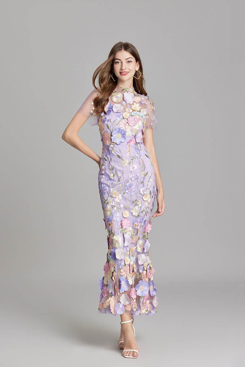 Livia | Elegant maxiklänning med blommigt mönster och transparens