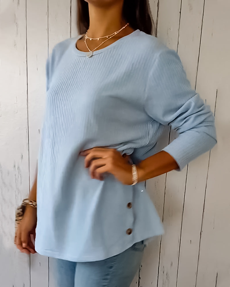 Elegant, strikket top med lange ærmer og rund hals