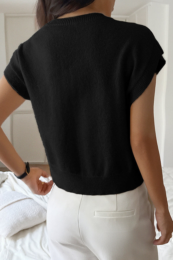 Elegant ærmeløs strikbluse med V-hals