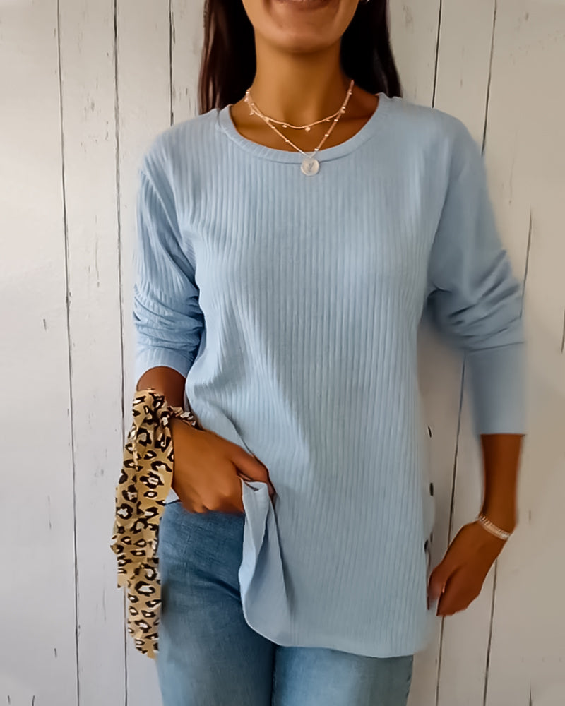 Elegant, strikket top med lange ærmer og rund hals